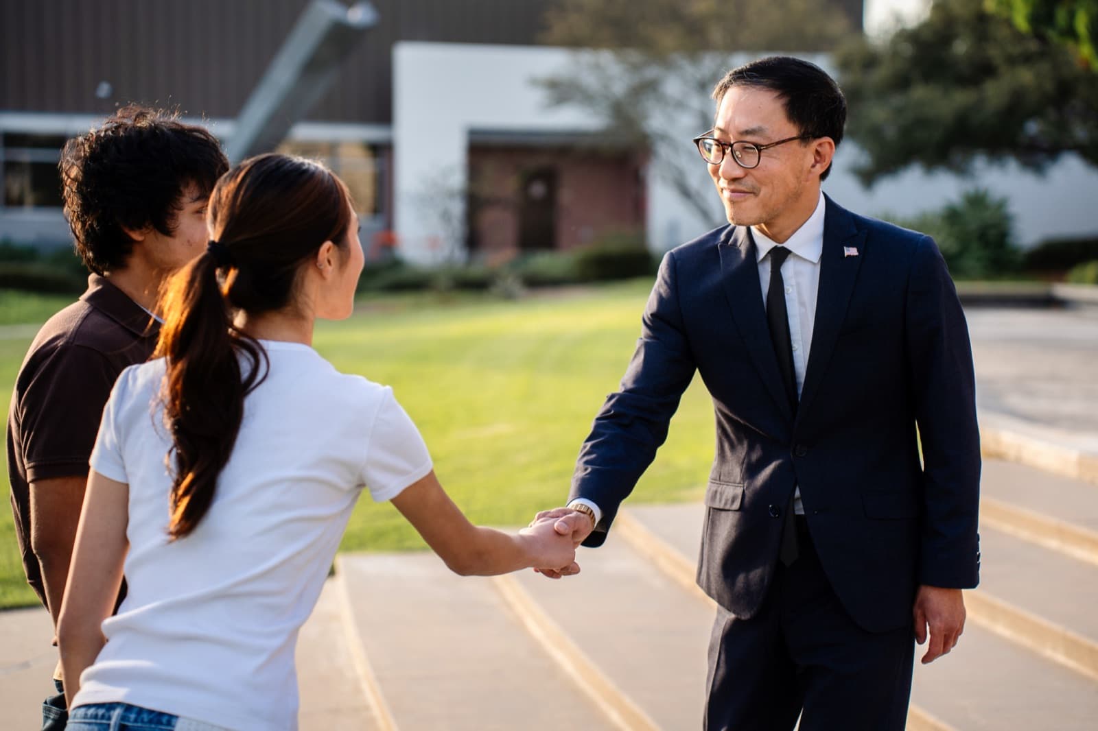 Fred Jung greeting community members and local business owners
